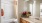 bathroom with a toliet and large mirror